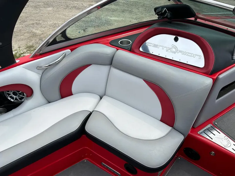 Slide: The Image of 2012 Centurion Enzo SV211 boat interior with red and gray seating. - 5