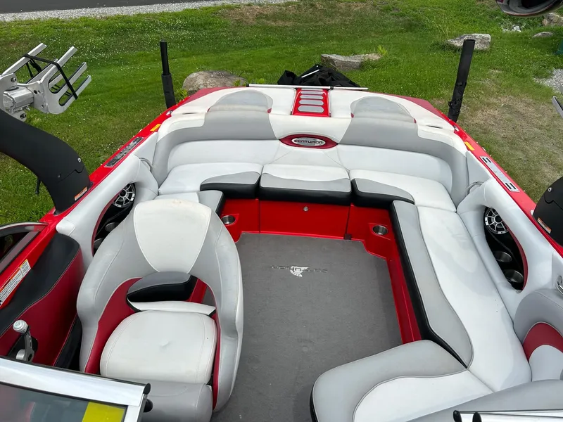 Slide: The Image of 2012 Centurion Enzo SV211 boat interior with red and white seating. - 6