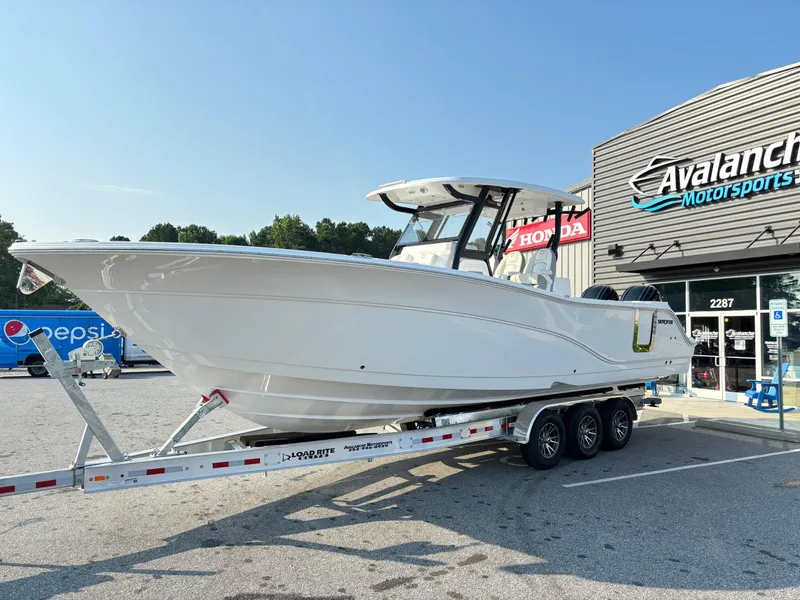 The Image of 2025 Sea Fox 328 Commander boat on trailer at dealership. - 1