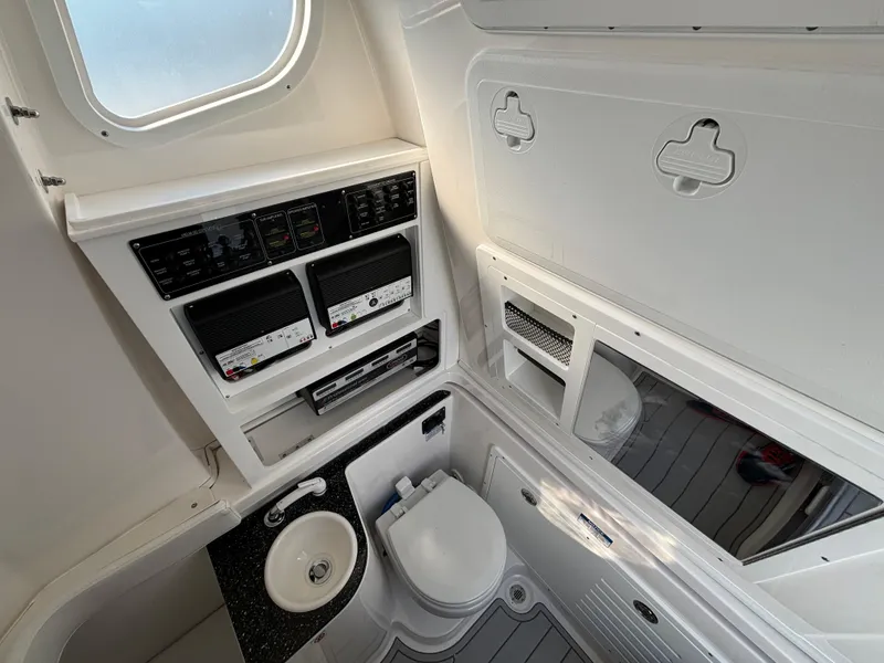 Slide: The Image of 2025 Sea Fox 328 Commander boat bathroom with modern amenities and sleek design. - 17
