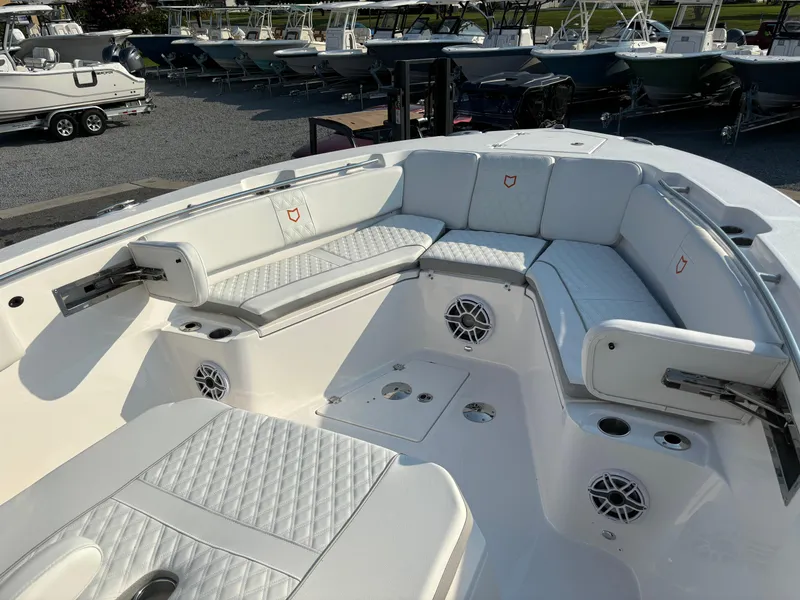Slide: The Image of 2025 Sea Fox 328 Commander boat interior with white seating and speakers. - 18