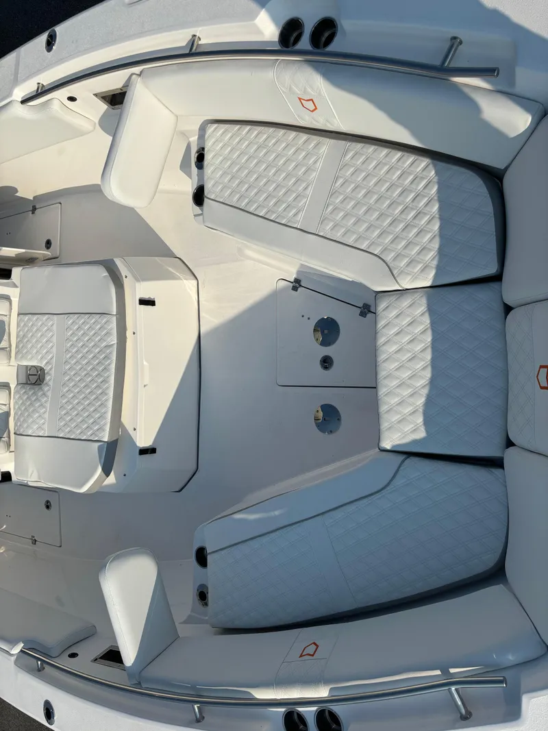 Slide: The Image of 2025 Sea Fox 328 Commander boat interior with white cushioned seating. - 20