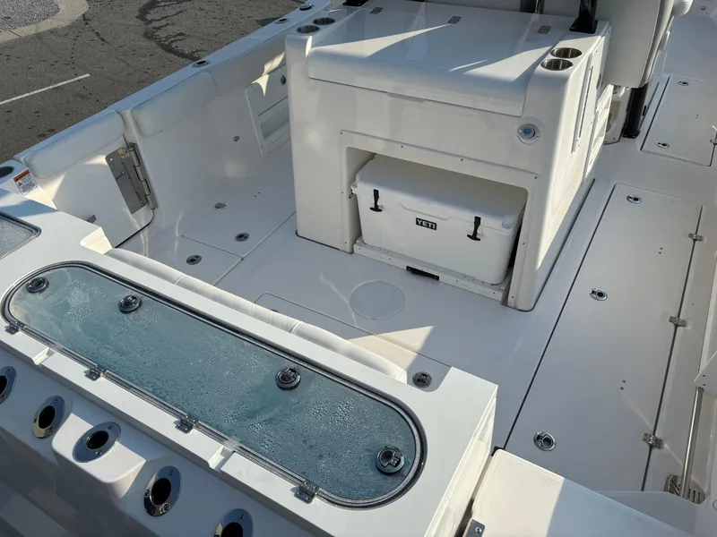 Slide: The Image of 2025 Sea Fox 328 Commander boat interior with storage and seating area. - 3