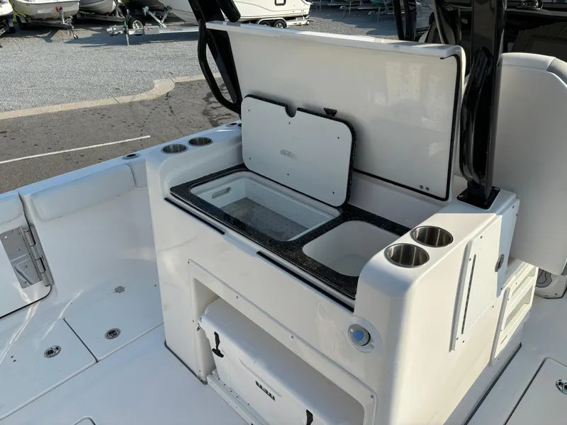 Slide: The Image of 2025 Sea Fox 328 Commander boat interior with storage and cup holders. - 8