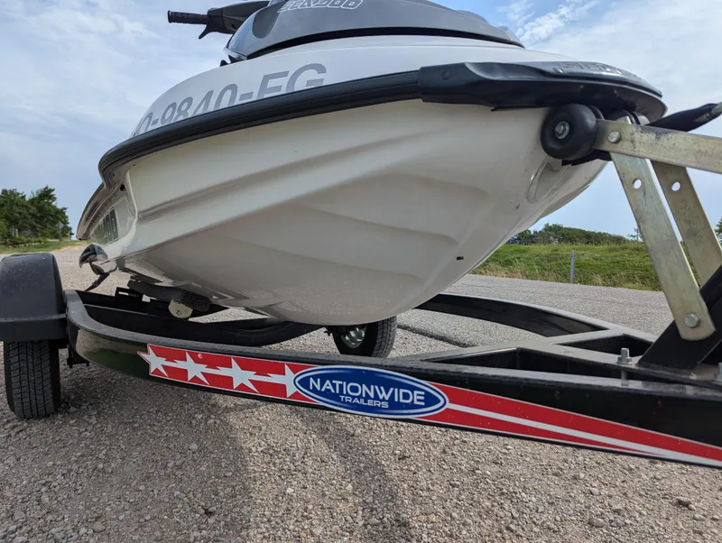 Slide: The Image of 2006 Sea-Doo GTX on Nationwide trailer, parked on gravel road. - 10