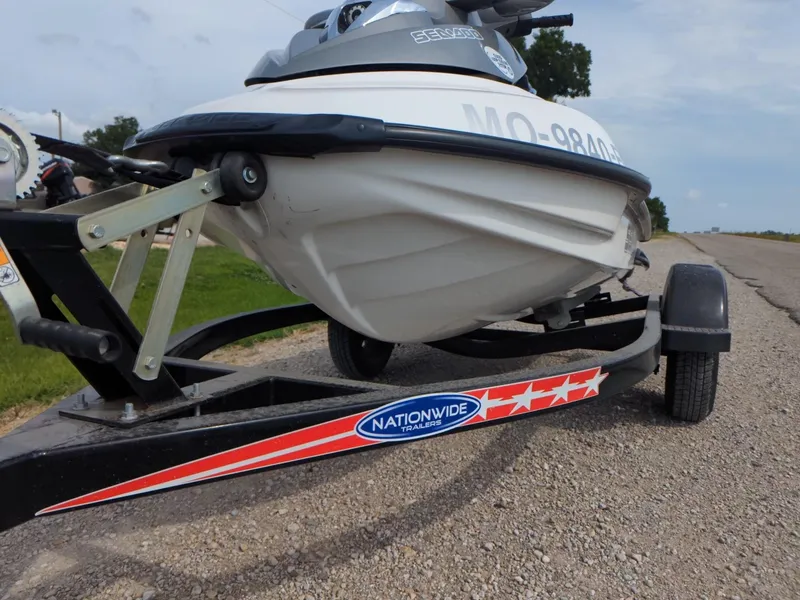 Slide: The Image of 2006 Sea-Doo GTX on trailer, parked on roadside. - 11