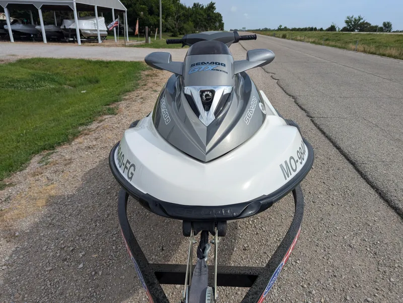 Slide: The Image of 2006 Sea-Doo GTX jet ski on trailer, parked on roadside. - 12