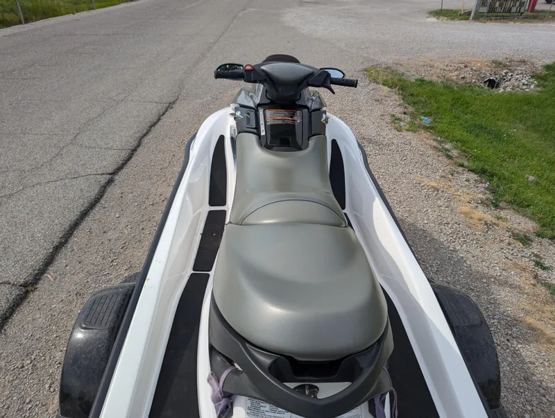 Slide: The Image of 2006 Sea-Doo GTX jet ski on trailer, parked on roadside. - 13