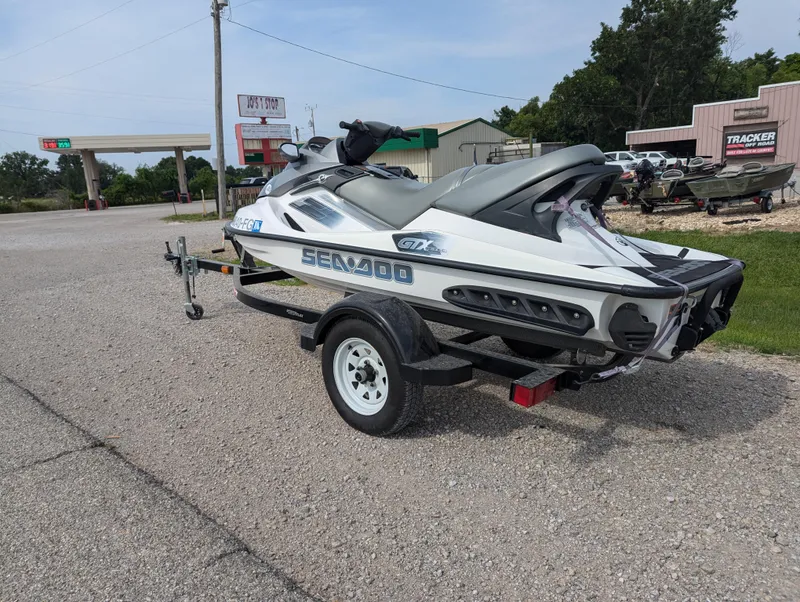 Slide: The Image of 2006 Sea-Doo GTX jet ski on trailer in parking lot. - 3