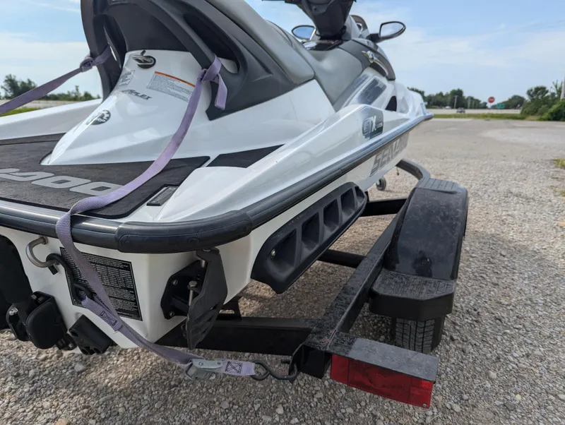 Slide: The Image of 2006 Sea-Doo GTX on trailer, parked on gravel road, ready for transport. - 6