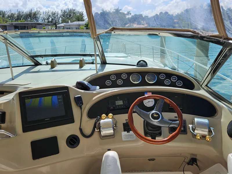 Slide: The Image of Cockpit view of a 2002 Sea Ray 460 Sundancer yacht with modern navigation equipment. - 11