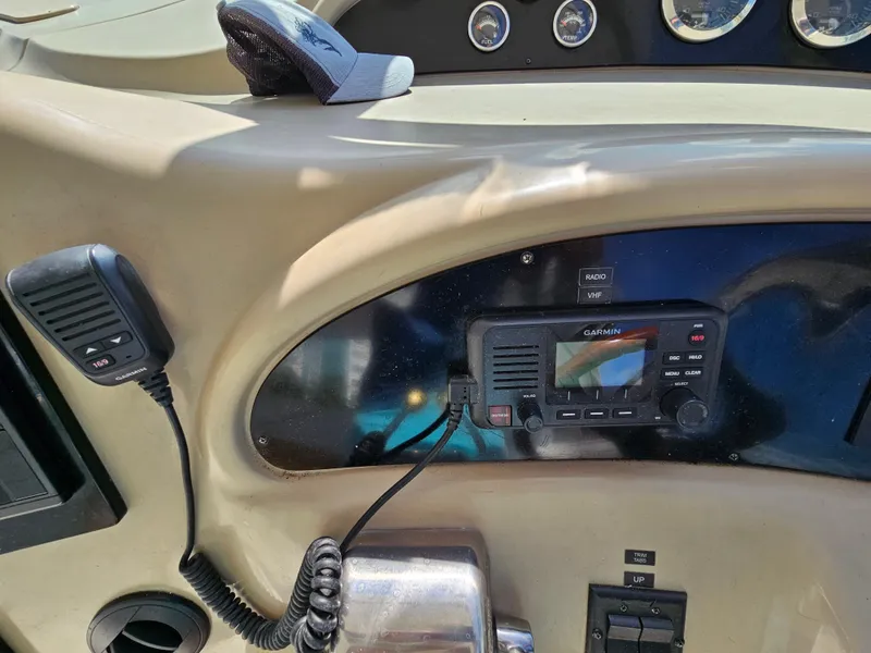 Slide: The Image of Control panel of a 2002 Sea Ray 460 Sundancer boat with radio and microphone. - 13