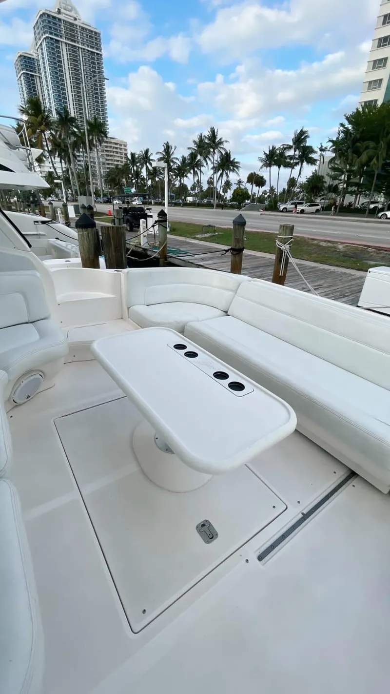 Slide: The Image of Luxurious 2002 Sea Ray 460 Sundancer yacht with spacious outdoor seating area. - 17