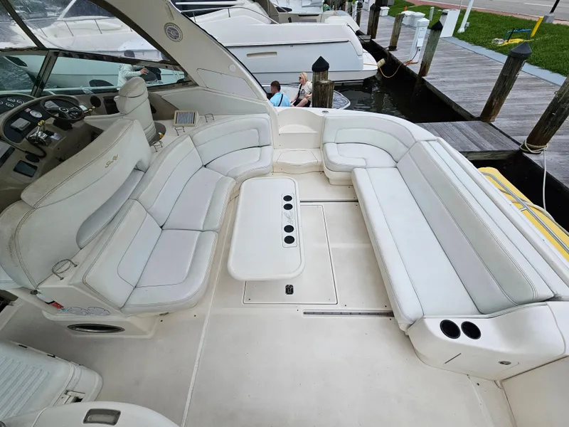 Slide: The Image of Luxurious 2002 Sea Ray 460 Sundancer yacht with spacious white seating area. - 18