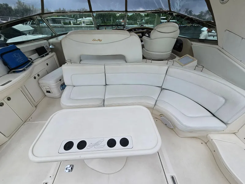 Slide: The Image of Luxurious 2002 Sea Ray 460 Sundancer yacht interior with plush seating and table. - 19
