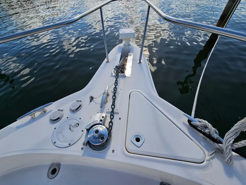 Slide: The Image of Bow of 2002 Sea Ray 460 Sundancer yacht with anchor chain and water reflections. - 6