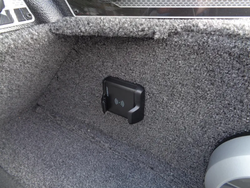 Slide: The Image of 2024 Lund 1650 Rebel XL Sport interior with wireless charging pad. - 29