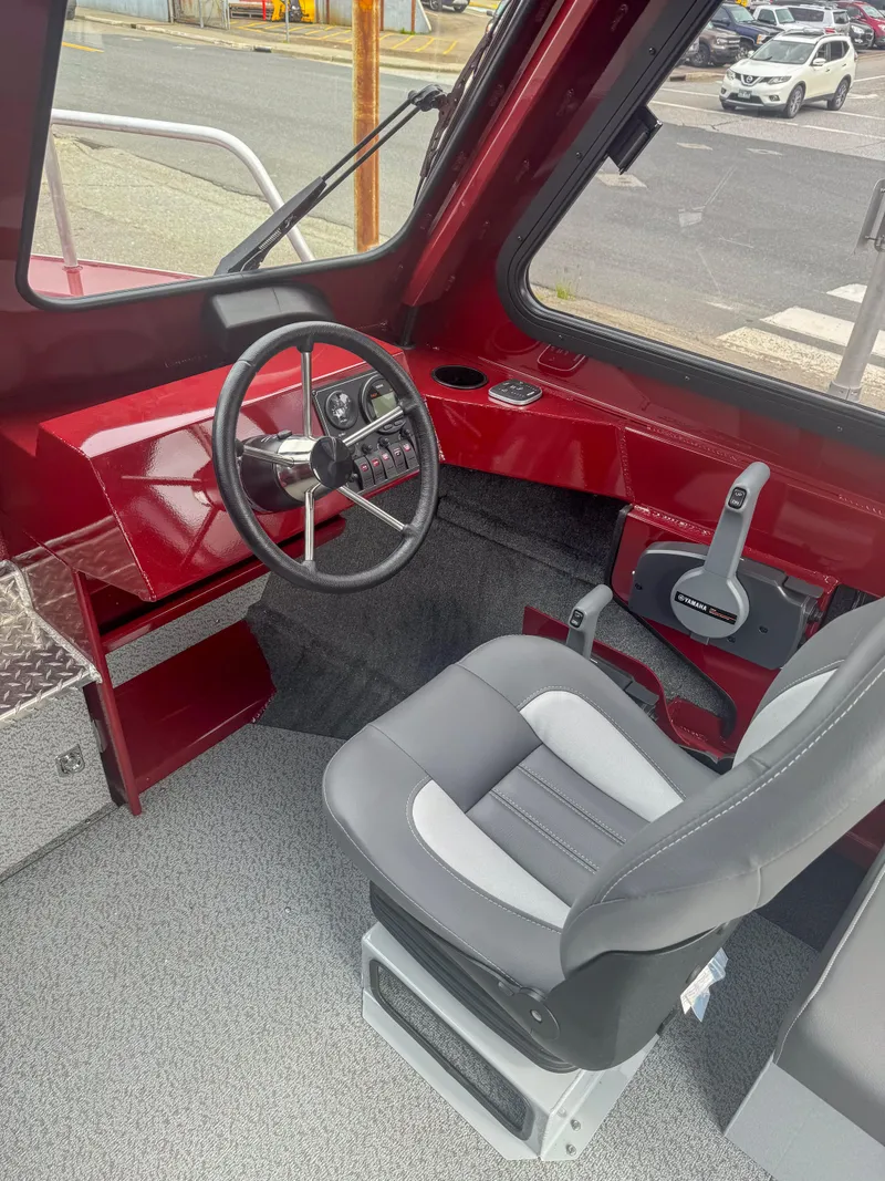 Slide: The Image of 2024 Hewescraft 200 ProV ET HT boat interior with steering wheel and seating. - 4
