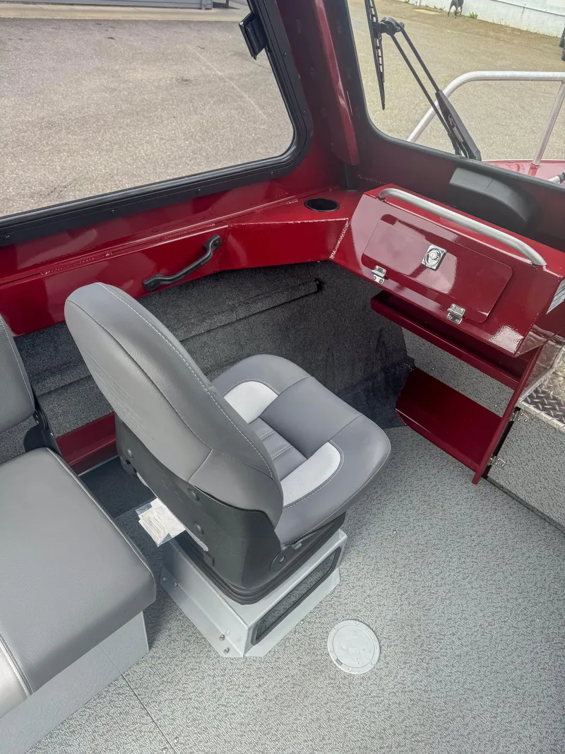 Slide: The Image of Interior of 2024 Hewescraft 200 ProV ET HT boat with gray seating and red accents. - 5