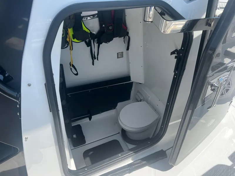 Slide: The Image of 2023 Blackfin 302 CC boat interior with dual seating and modern console. - 21