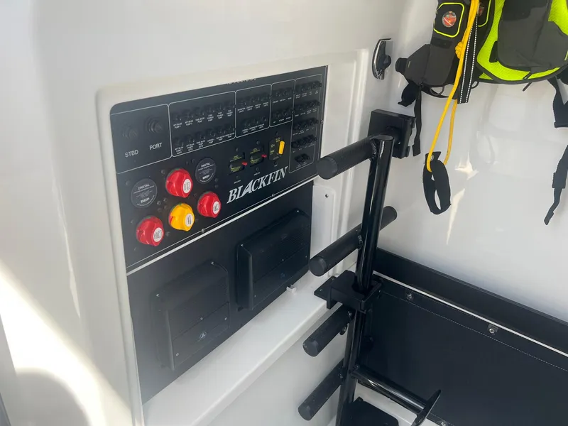 Slide: The Image of 2023 Blackfin 302 CC joystick control and cup holder. - 22