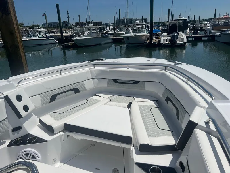 Slide: The Image of 2023 Blackfin 302 CC boat interior, featuring sleek seating and modern design. - 26