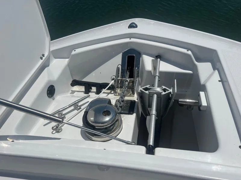 Slide: The Image of 2023 Blackfin 302 CC boat interior with seating and table, docked at marina. - 28