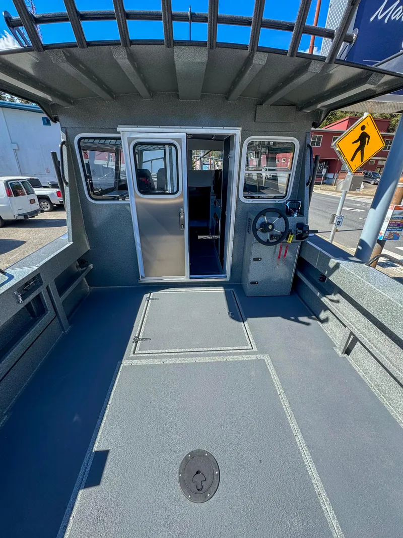 Slide: The Image of 2024 North River Seahawk OS 2700SXL boat deck and cabin entrance. - 13