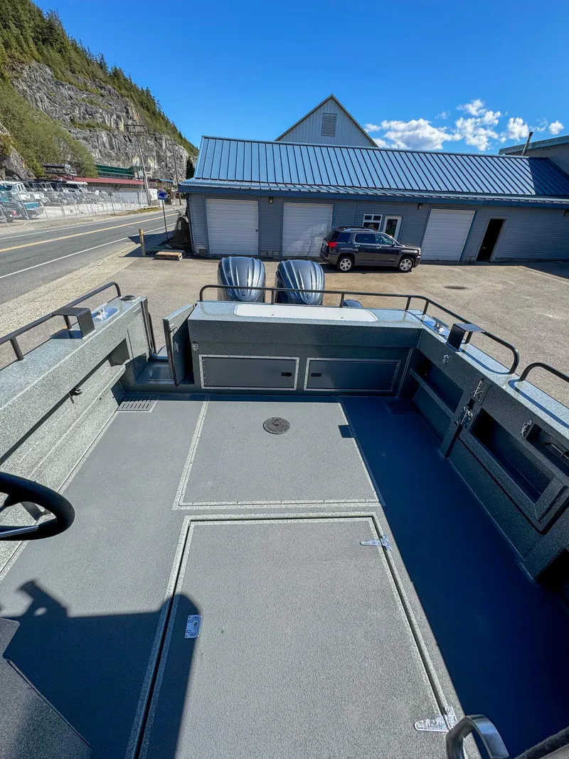 Slide: The Image of 2024 North River Seahawk OS 2700SXL boat deck with storage compartments. - 15