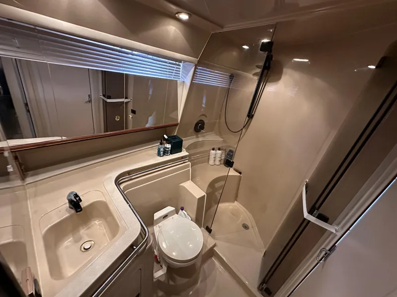 Slide: The Image of 1999 Cruisers Yachts 4270 Esprit bathroom with sink, toilet, and shower. - 16
