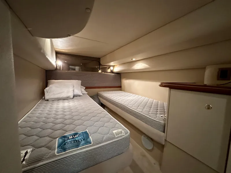 Slide: The Image of 1999 Cruisers Yachts 4270 Esprit cabin with twin beds and modern lighting. - 19