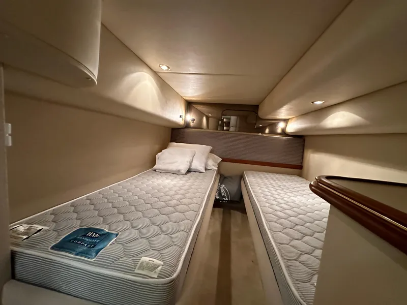 Slide: The Image of 1999 Cruisers Yachts 4270 Esprit cabin with twin beds and ambient lighting. - 20