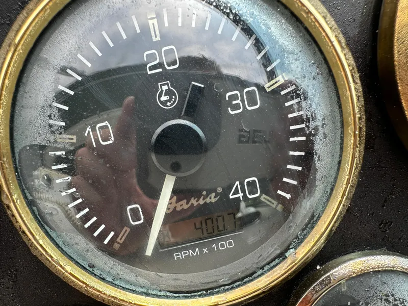 Slide: The Image of Close-up of a 1999 Cruisers Yachts 4270 Esprit tachometer showing 400 RPM. - 21