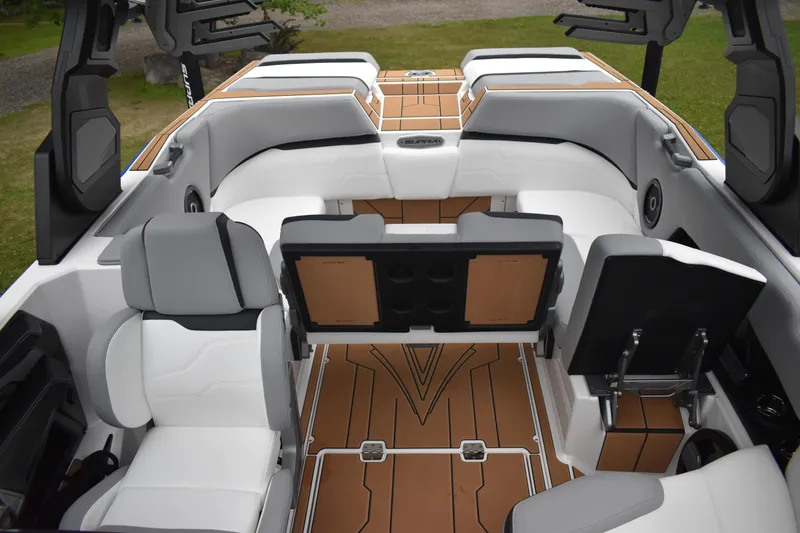 Slide: The Image of 2024 Supra SV boat interior with white and tan seating, modern design. - 6