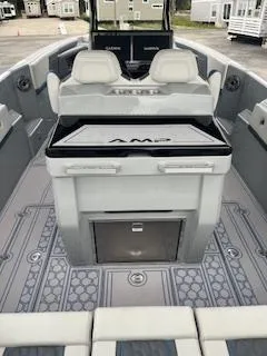 Slide: The Image of 2025 AMP 333CC boat interior with modern seating and advanced controls. - 10