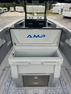 Slide: The Image of 2025 AMP 333CC boat with open storage compartment and modern design. - 11