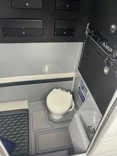 Slide: The Image of 2025 AMP 333CC boat interior with modern bathroom amenities. - 15