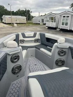 Slide: The Image of 2025 AMP 333CC boat interior with modern seating and speakers. - 18