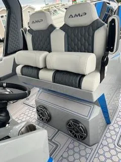 Slide: The Image of 2025 AMP 333CC boat interior with dual seats and modern design. - 19