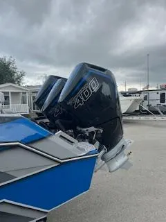 Slide: The Image of 2025 AMP 333CC boat with twin 400 horsepower outboard engines. - 4