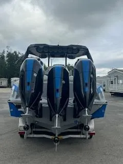 Slide: The Image of 2025 AMP 333CC boat with triple outboard engines, rear view. - 5