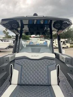 Slide: The Image of 2025 AMP 333CC boat with modern design and luxurious seating. - 8