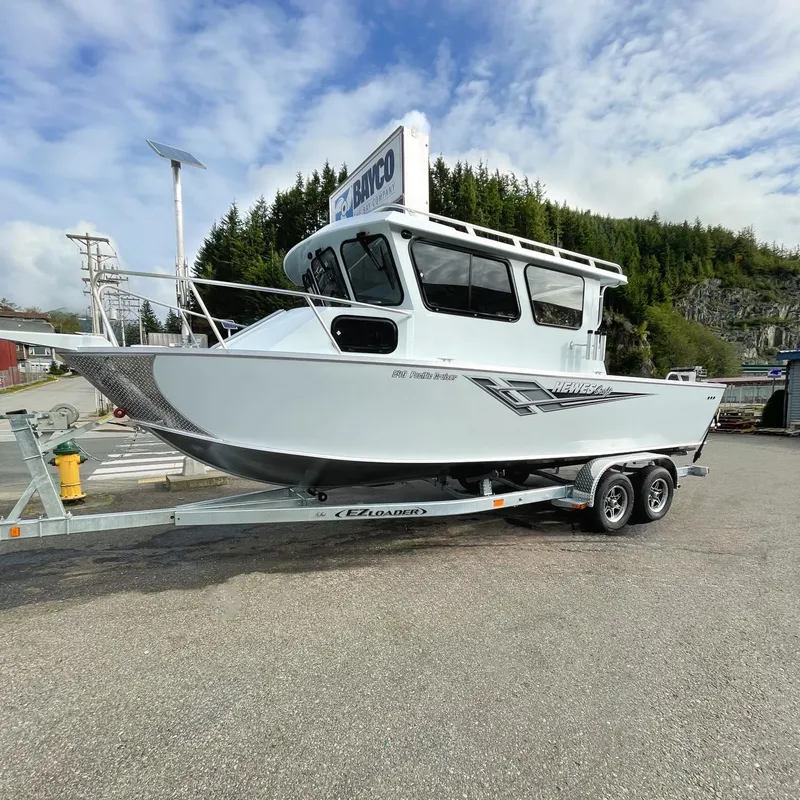 Slide: The Image of 2024 Hewescraft 240 Pacific Cruiser on trailer in outdoor setting. - 1