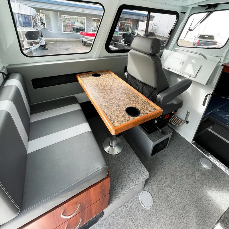 Slide: The Image of Interior of 2024 Hewescraft 240 Pacific Cruiser with seating and table. - 5
