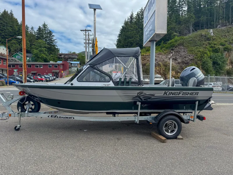 The Image of 2024 KingFisher 1825 Falcon boat on trailer, parked outdoors. - 0