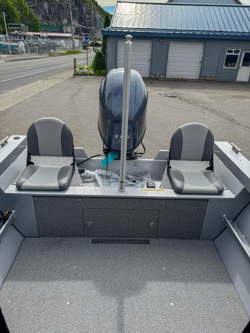 Slide: The Image of 2024 KingFisher 1825 Falcon boat with dual seats and outboard motor. - 6