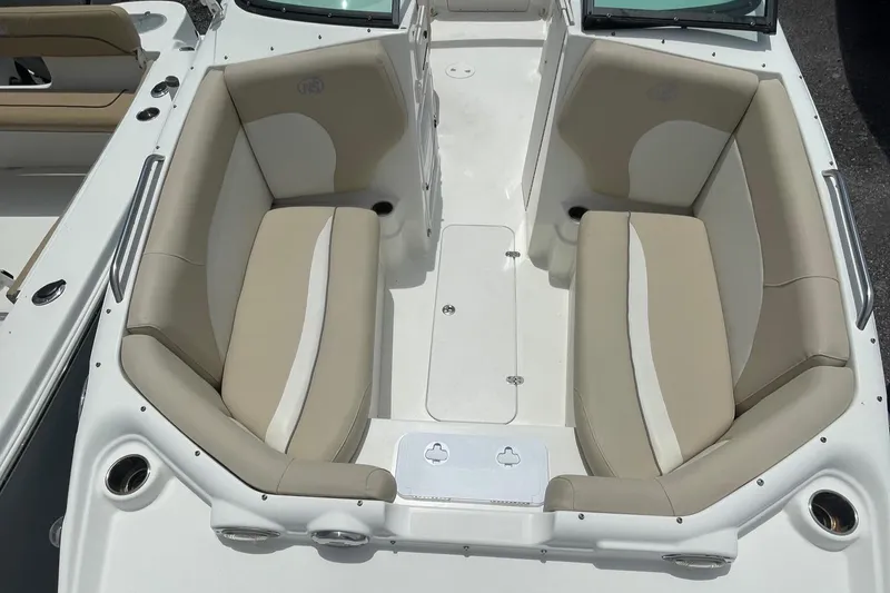 Slide: The Image of 2018 NauticStar 223DC Sport Deck boat interior with beige and white seating. - 11
