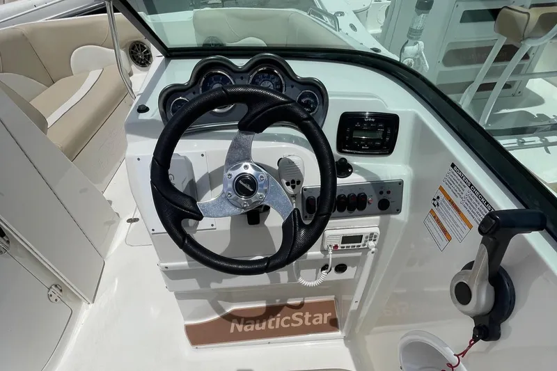Slide: The Image of 2018 NauticStar 223DC Sport Deck boat steering console and dashboard. - 9