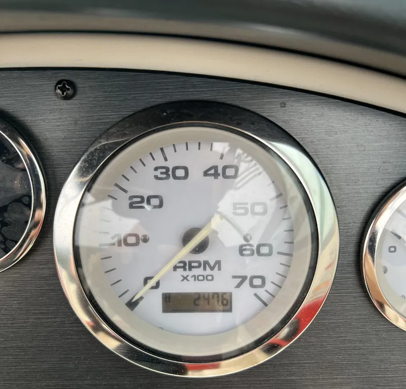 Slide: The Image of Close-up of 2007 Sea Ray 185 Sport RPM gauge displaying 247.6 hours. - 6