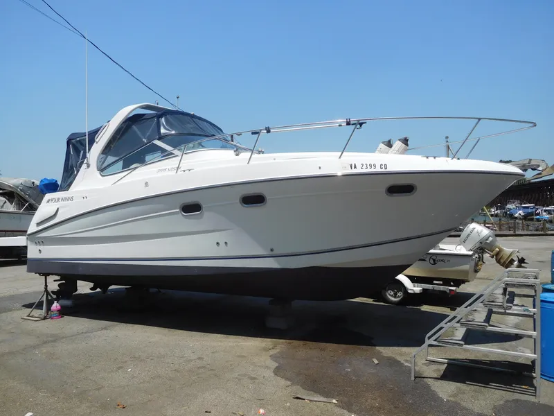 Slide: The Image of 2001 Four Winns 298 Vista boat on dry dock. - 0